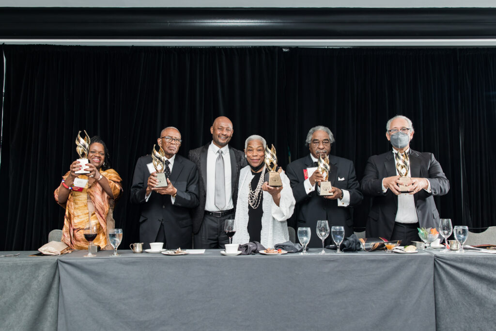 A group of recipients stand with their awards at the NBL Hall of Fame Presentation